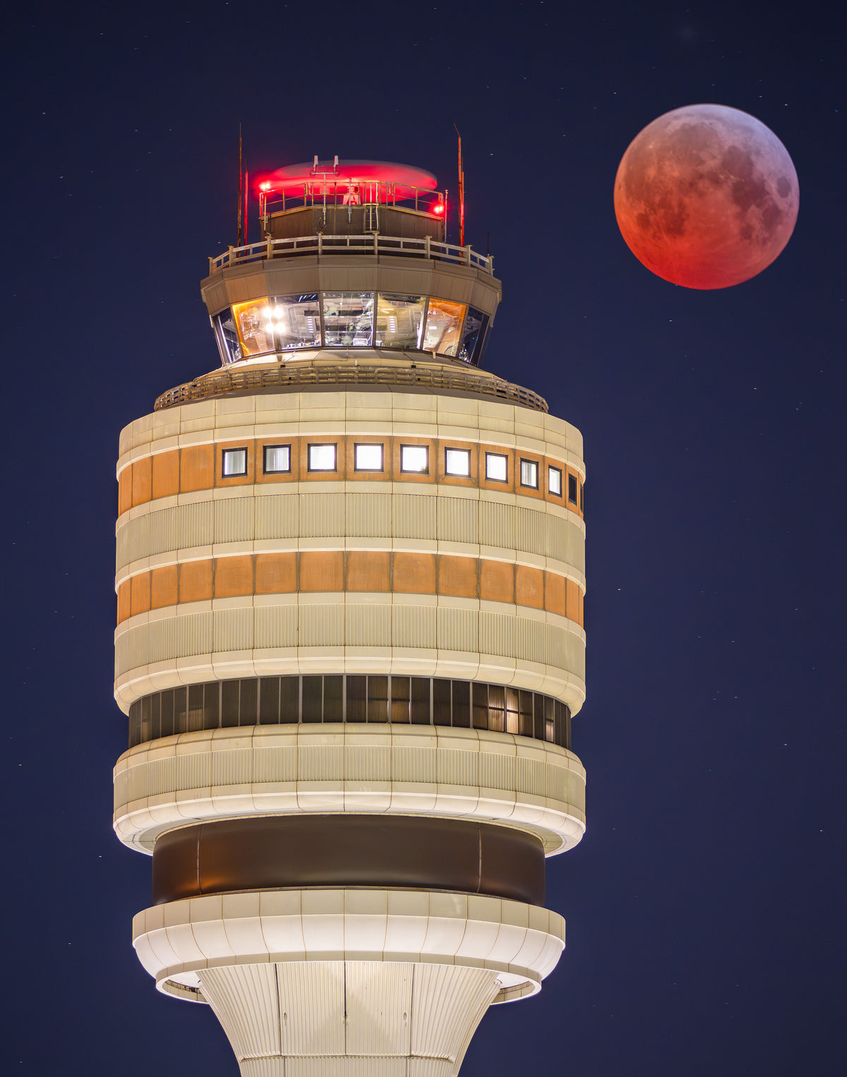 Towering Over a Blood Moon | Eclipse at MCO Tower